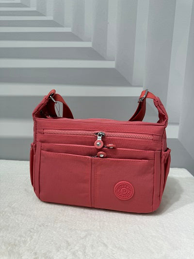 2154 GESSY CROSSBODY BAG IN CORAL